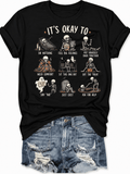Women’s Skeleton Inspirational Self-Care T-Shirt, “It’s Okay to” Humorous Halloween Graphic Tee, Spooky Season Top